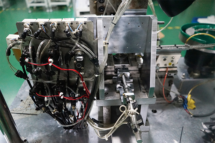Load bearing wheel and shaft assembly machine